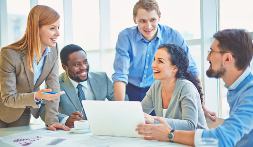Employees having a discussion in the office